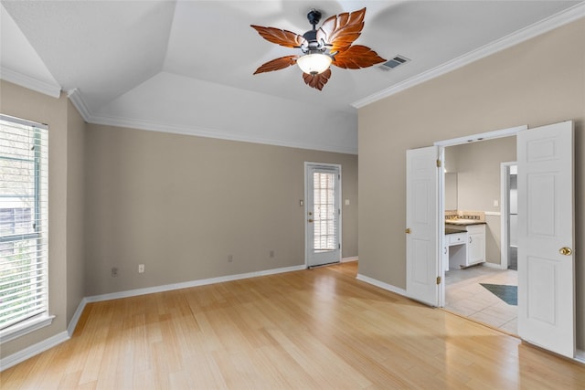 interior space featuring ornamental molding, light wood-type flooring, lofted ceiling, and ceiling fan