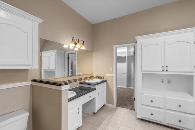 10018 Wild Dunes Dr, Austin, TX 78747 - full bath with vanity and tile patterned flooring