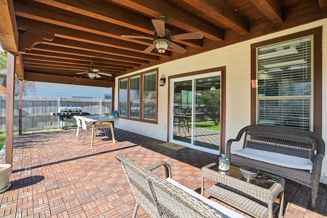 view of patio with ceiling fan and a grill