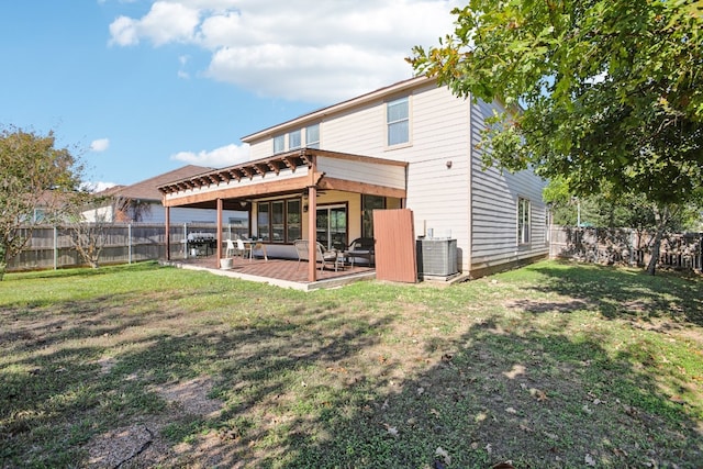 back of house featuring central AC, a yard, and a patio