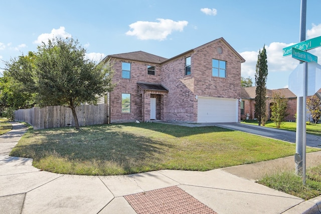 view of property featuring a front yard and a garage