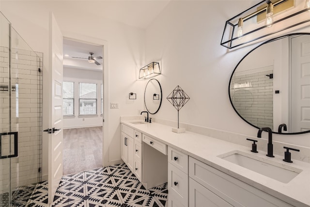 bathroom featuring vanity, ceiling fan, tile patterned floors, and a shower with shower door