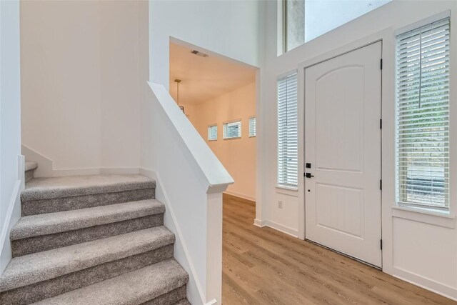 407 Meadowlark St, Austin, TX 78734 - foyer with light wood-style floors and stairway