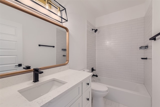 full bathroom featuring toilet, tiled shower / bath combo, and vanity