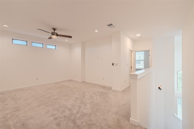 407 Meadowlark St, Austin, TX 78734 - spare room featuring a ceiling fan, light colored carpet, and recessed lighting