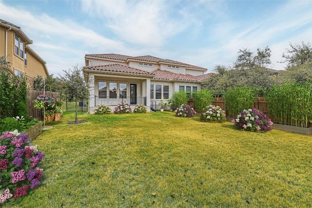 407 Meadowlark St, Austin, TX 78734 - back of property with a tiled roof, stucco siding, and a fenced backyard