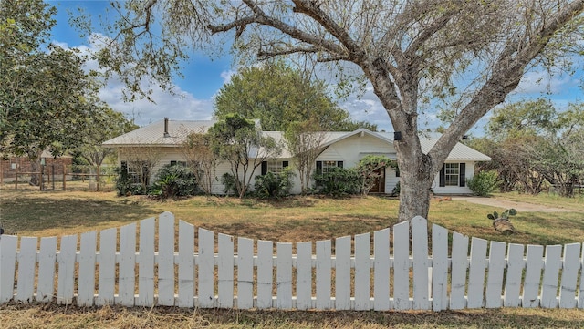 ranch-style house with a front lawn