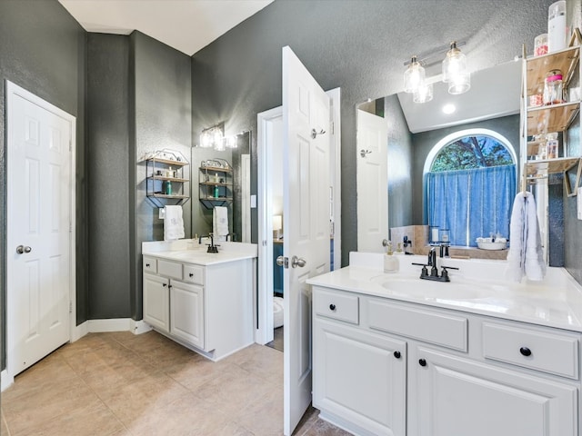 bathroom with vanity and tile patterned floors