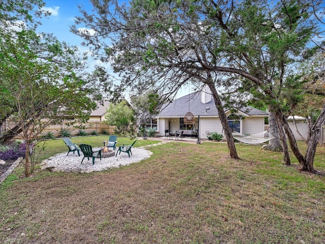 view of yard with a patio and a fire pit