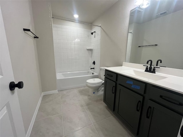 full bathroom with tile patterned flooring, vanity, tiled shower / bath combo, and toilet