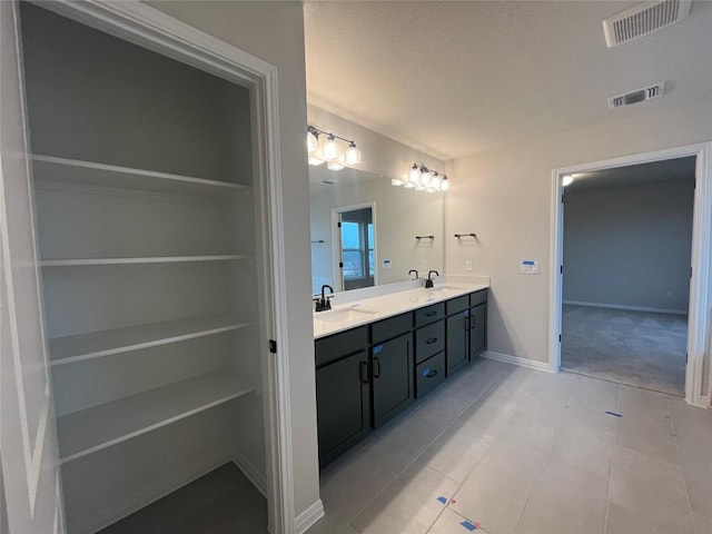 bathroom with vanity and built in features