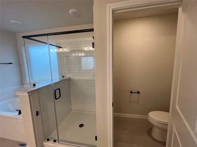 bathroom featuring toilet and shower with separate bathtub