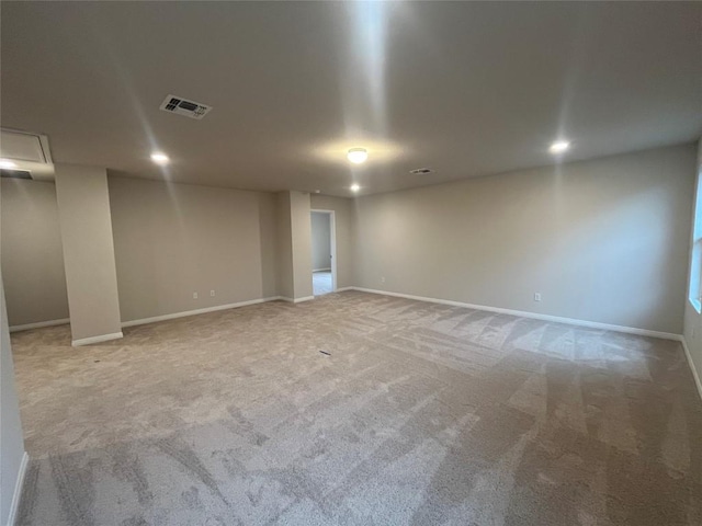 empty room with light colored carpet