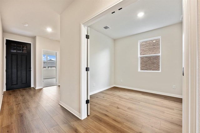 foyer entrance with light hardwood / wood-style flooring