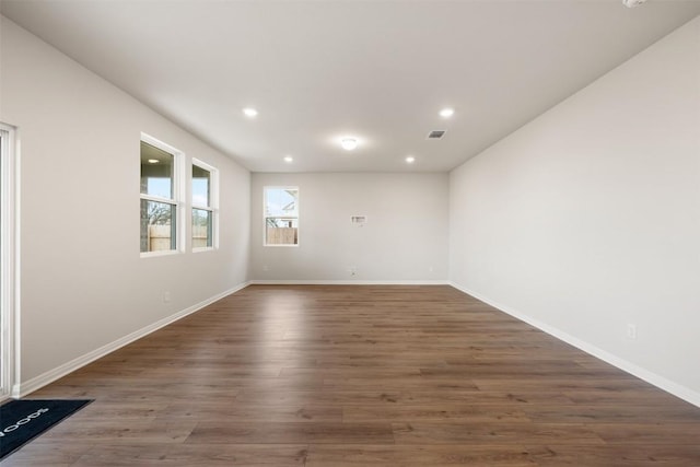 empty room featuring dark hardwood / wood-style floors