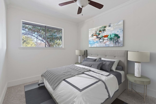 bedroom featuring ceiling fan, carpet, and ornamental molding