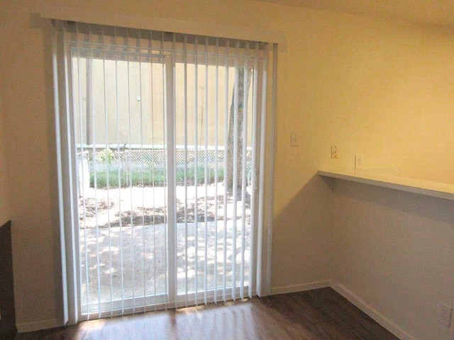 doorway to outside with hardwood / wood-style flooring