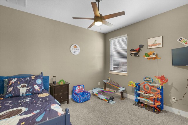 bedroom featuring ceiling fan and carpet