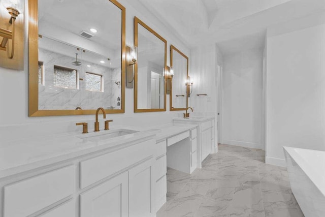 bathroom with vanity and independent shower and bath