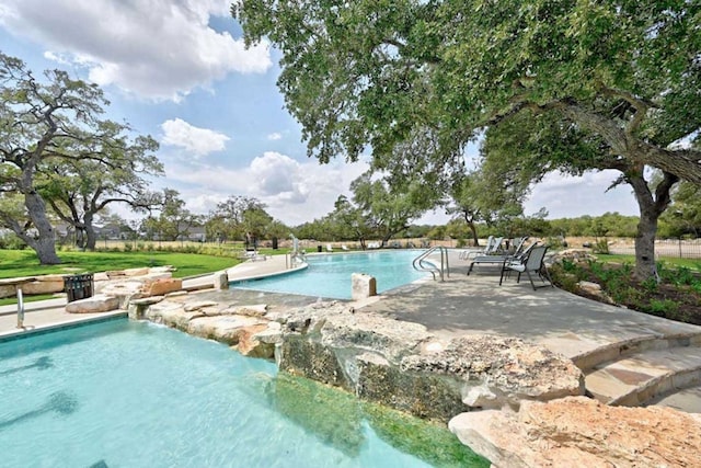 view of swimming pool featuring a patio