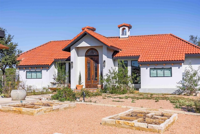 mediterranean / spanish home with french doors