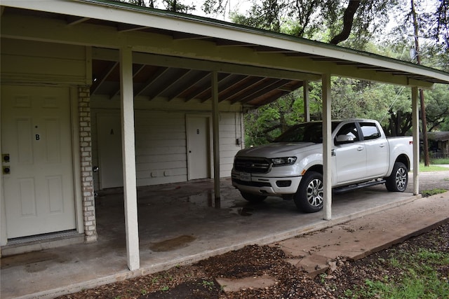 view of vehicle parking featuring a carport