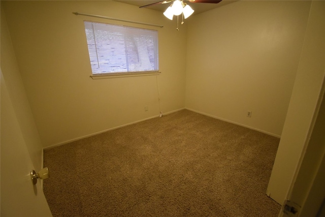 empty room featuring carpet flooring and ceiling fan