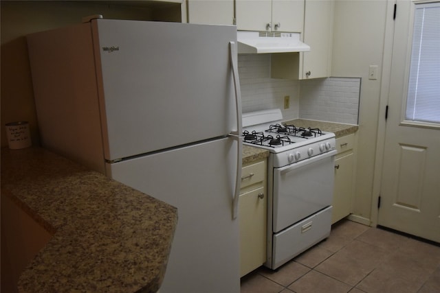 kitchen with white cabinetry, white appliances, decorative backsplash, and light tile patterned floors