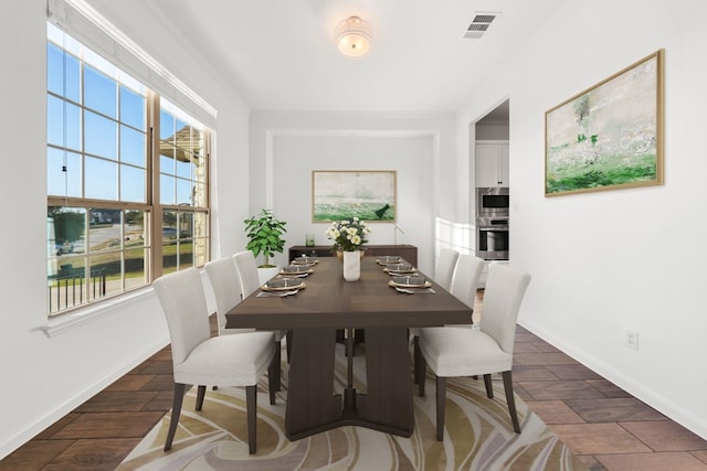 dining area with dark wood-type flooring