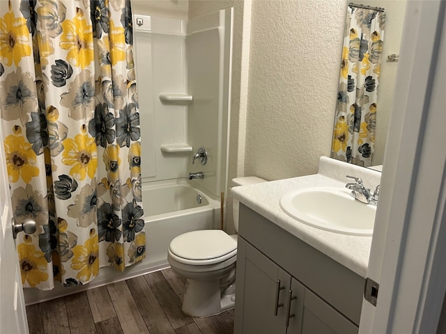 full bathroom with hardwood / wood-style floors, vanity, toilet, and shower / bathtub combination with curtain