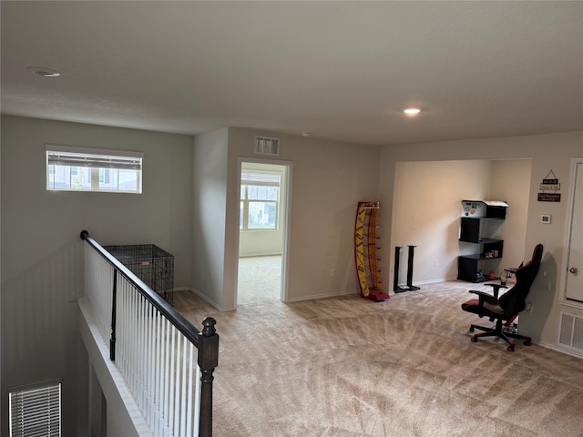 interior space featuring light carpet