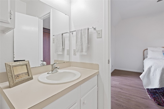 bathroom with vanity and hardwood / wood-style flooring