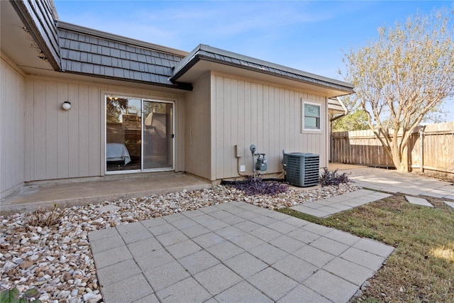 back of property featuring a patio and cooling unit