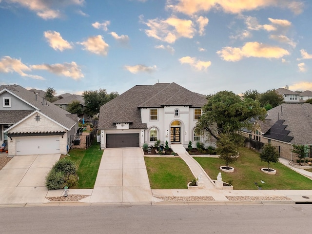 view of front of property with a front lawn and a garage