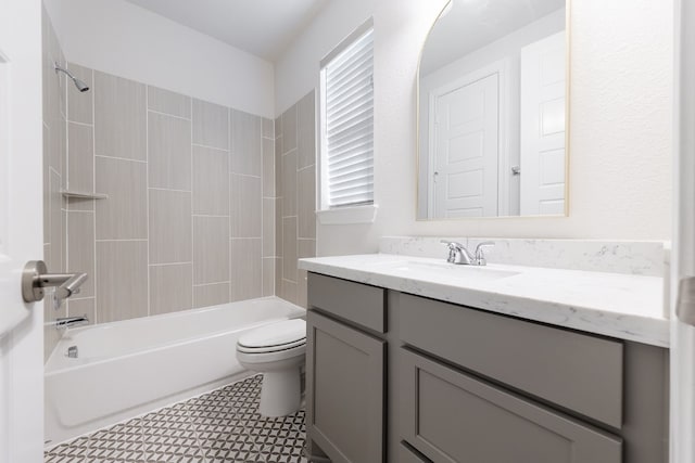 full bathroom with vanity, toilet, and tiled shower / bath