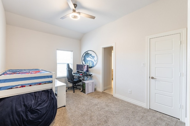 bedroom with ceiling fan, light colored carpet, and vaulted ceiling