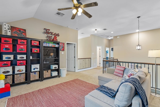 carpeted living room with ceiling fan and lofted ceiling