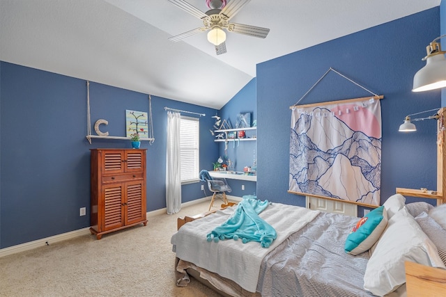 carpeted bedroom featuring ceiling fan and lofted ceiling