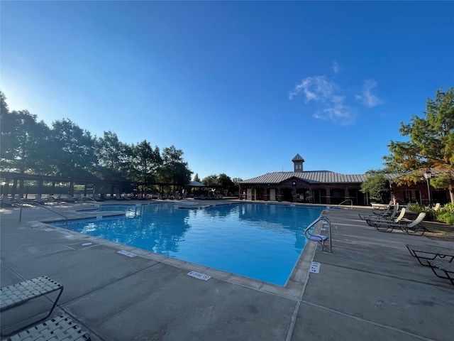 view of pool featuring a patio area