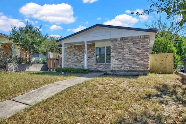 view of side of home featuring a lawn