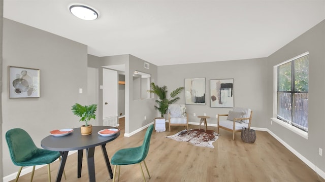 dining area with hardwood / wood-style floors