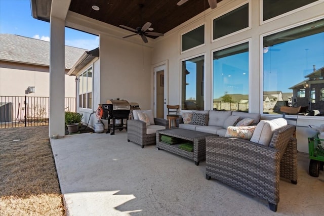 view of patio / terrace with ceiling fan and an outdoor living space