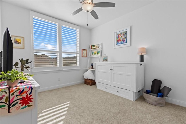 carpeted bedroom featuring ceiling fan