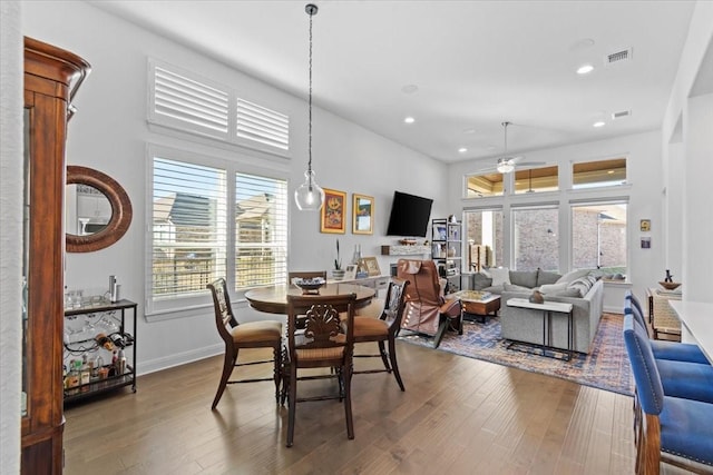 dining space featuring ceiling fan and hardwood / wood-style floors