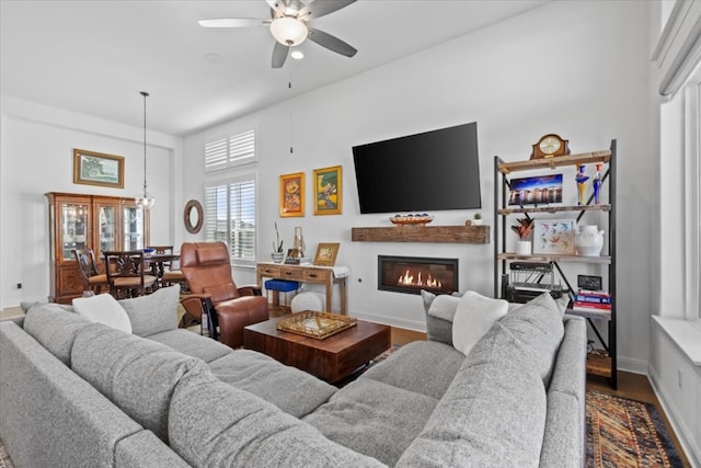 living room featuring hardwood / wood-style flooring and ceiling fan