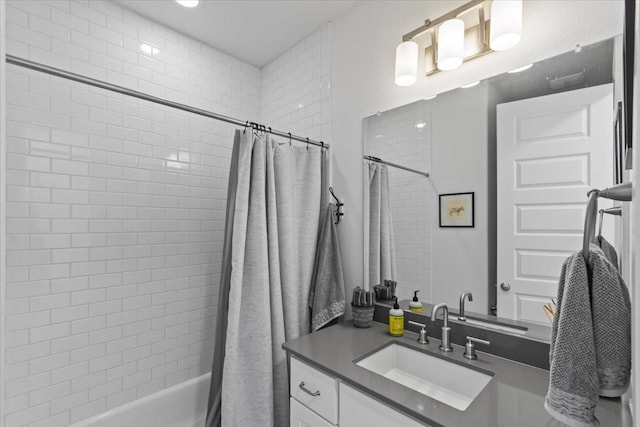 bathroom featuring shower / bathtub combination with curtain and vanity