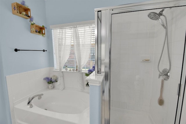 bathroom with shower with separate bathtub