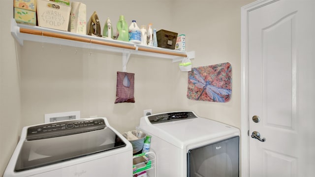 laundry area featuring washing machine and clothes dryer