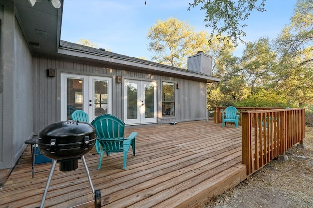 wooden terrace with french doors and grilling area