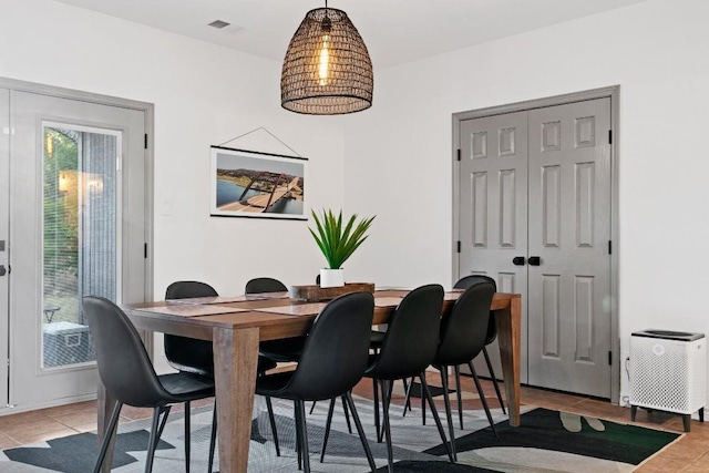 dining room featuring light tile patterned flooring